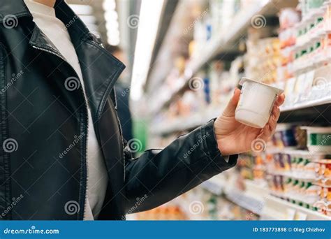 Close Up Women S Hands Hold Groceries In The Store The Concept Of