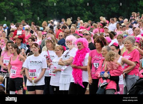 Crowd In Pink At A Cancer Research Uk Race For Life Charity Event Stock
