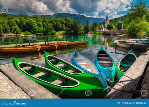 Moored Canoes And Wooden Boats On The Lake Bohinj Slovenia Stock Photo