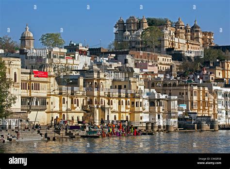 women bathing in the ahar river in the city of udaipur city of lakes rajasthan india stock