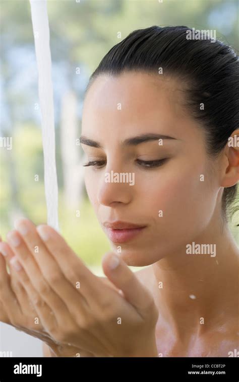 Woman With Cupped Hands Under Running Water Stock Photo Alamy