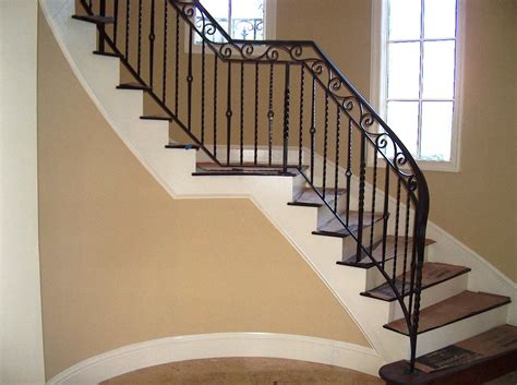 Wrought iron banister rail wall support hand railings for stairs. Wrought Iron Stair Railing
