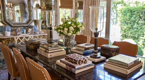 A pup in each space. Dining table laid with books | Dining table decor, Library table, Luxe living room
