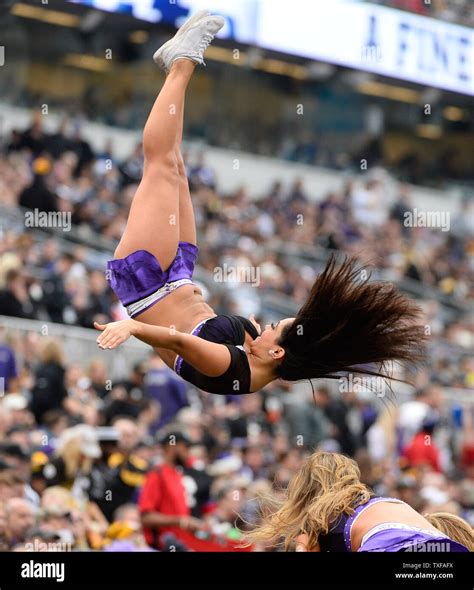 A Baltimore Ravens Cheerleader Performs During The First Half Of Their