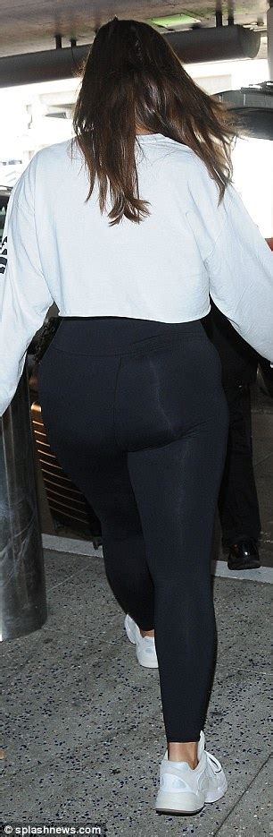 Ashley Graham Sports A Crop Top And Skintight Leggings As She Arrives At Lax Daily Mail Online
