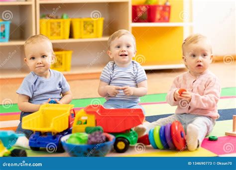 Babies Playing Together In The Kindergarten Stock Image Image Of