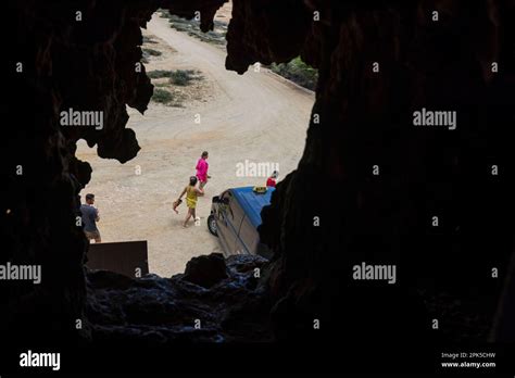 View Of Tourists Through Opening In Quadirikiri Caves Of Arikok