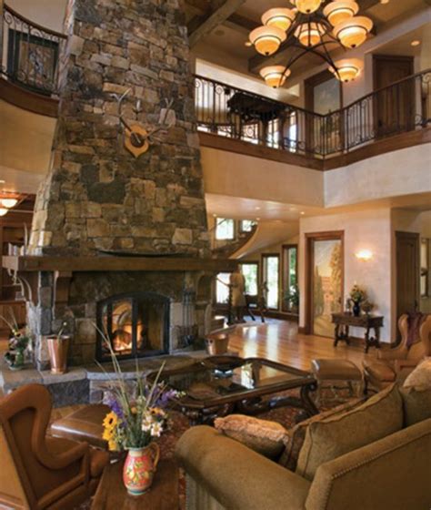 Great Room Featuring Two Story Stone Fireplace Second Floor Balcony