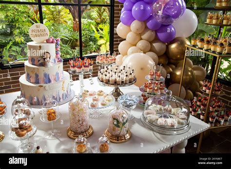 Table Of Desserts And Sweets At The First Communion Party Design With