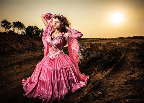 Attractive Romantic Woman On Beautiful Pink Dress Pose Outdoor Stock