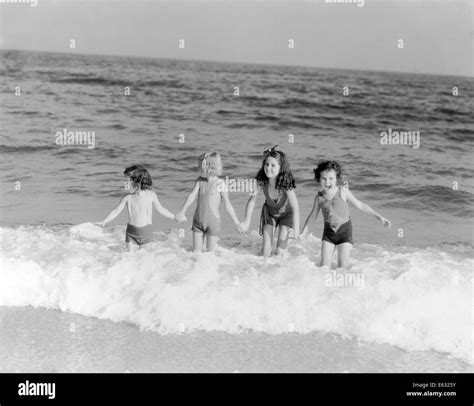 1930s 4 Little Girls Standing Surf Waves Ocean Beach Shore Fun Summer