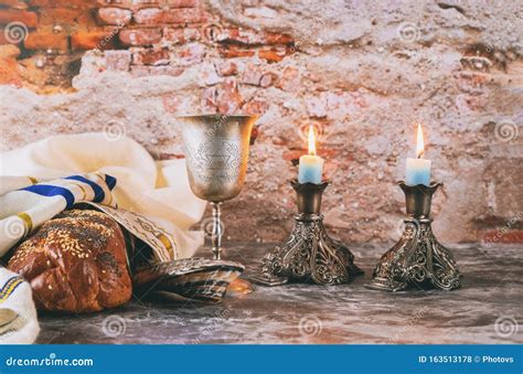Sabbath Jewish Holiday Challah Bread And Candelas On Wooden Table Stock