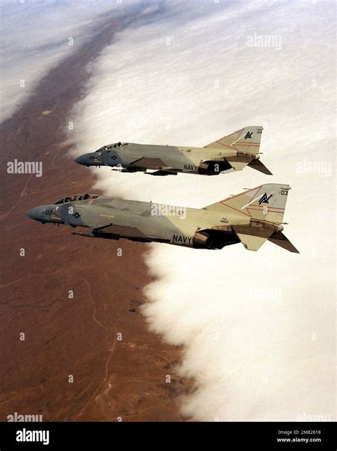 An Air To Air Left Side View Of Two Fighter Squadron 301 Vf 301 F 4