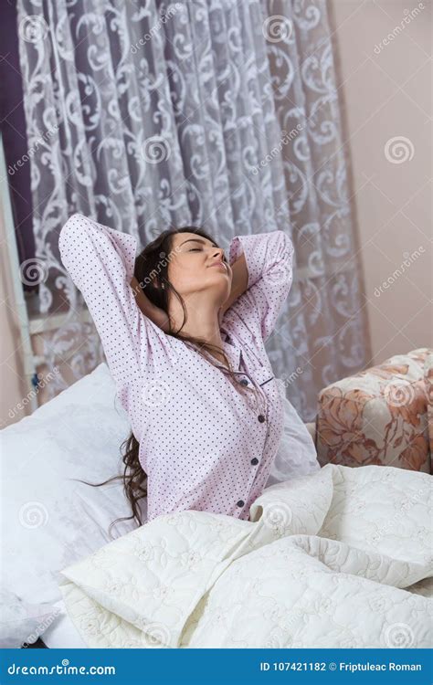 Young Beautiful Woman Awaking In Light Room Relaxed Woman Lying In Bed In Sleepwear Stock