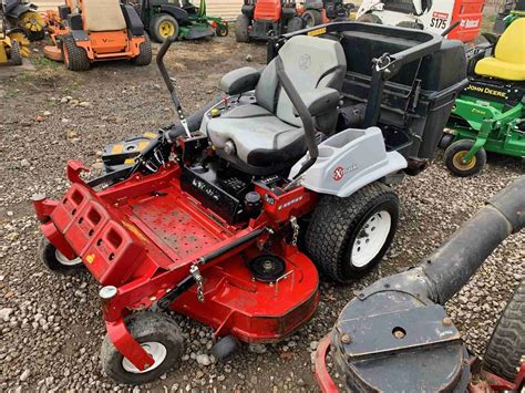 IN EXMARK LAZER Z COMMERCIAL ZERO TURN W BAGGER ONLY A MONTH Lawn Mowers For Sale