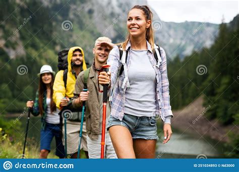 Group Of Happy Fit Friends Hiking Trekking Together Outdoor Nature