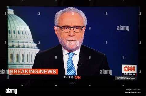 A Cnn Television Screen Shot Shows News Anchor Wolf Blitzer Reporting