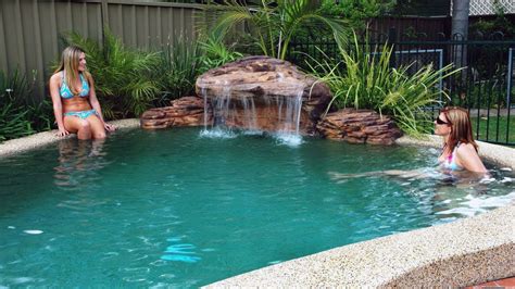 See how a big heap of assorted rocks and pebbles is transformed into a shallow pond, incorporating larger boulders, plants and a bamboo fountain. Pool Water Features & Custom Waterfalls - YouTube