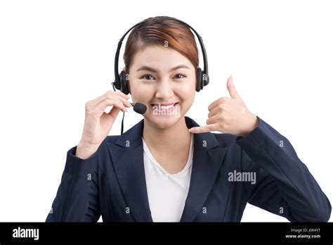 Portrait Of Beautiful Young Asian Female Customer Service Representative In Headset Looking At