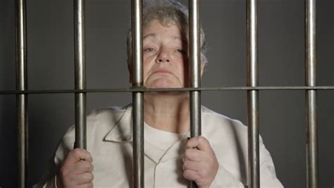 Royalty Free Woman Excitedly Reaching Through Prison Bars 16329406