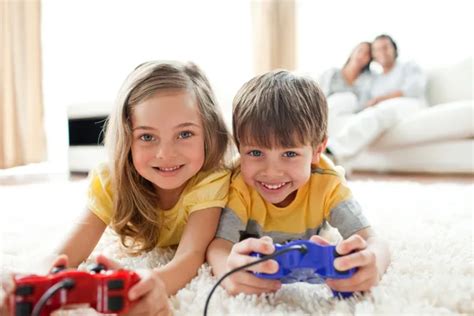 Adorable Siblings Playing Video Games — Stock Photo © Wavebreakmedia