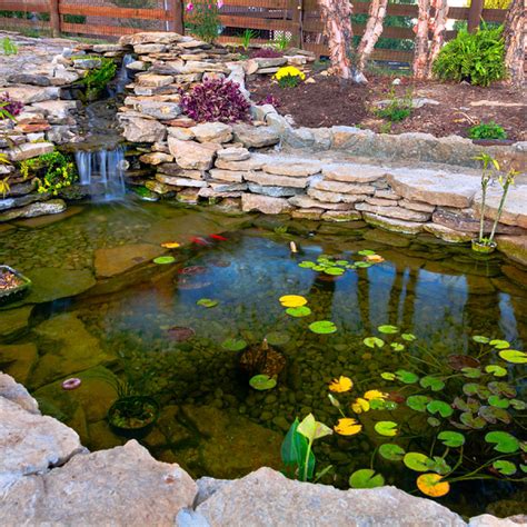 This cool diy koi pond is a modern design and will fit in perfectly with a minimal, modern backyard plan. Koi Pond Designs - Landscaping Gazette Online