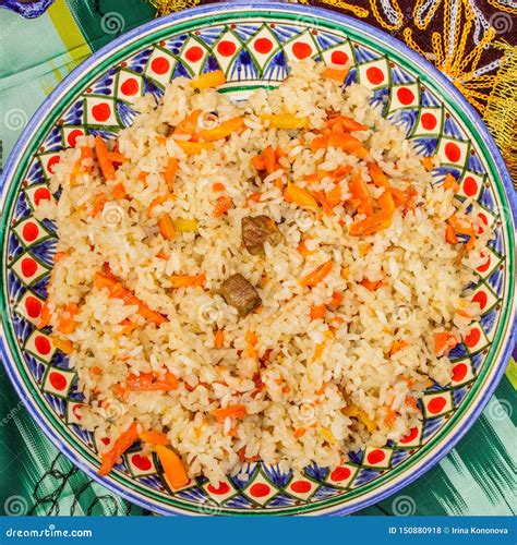 Oriental Cuisine Uzbek Pilaf Or Plov Of Rice And Meat In A Plate With