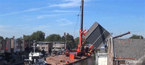 Two Giant Cranes Holding A Bridge Collapse Into Nearby Homes Gizmodo