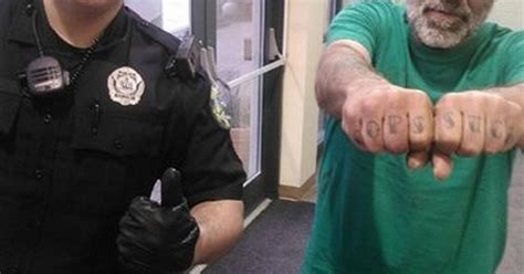 Police Smile At Cops Suck Tattoo Across Mans Knuckles