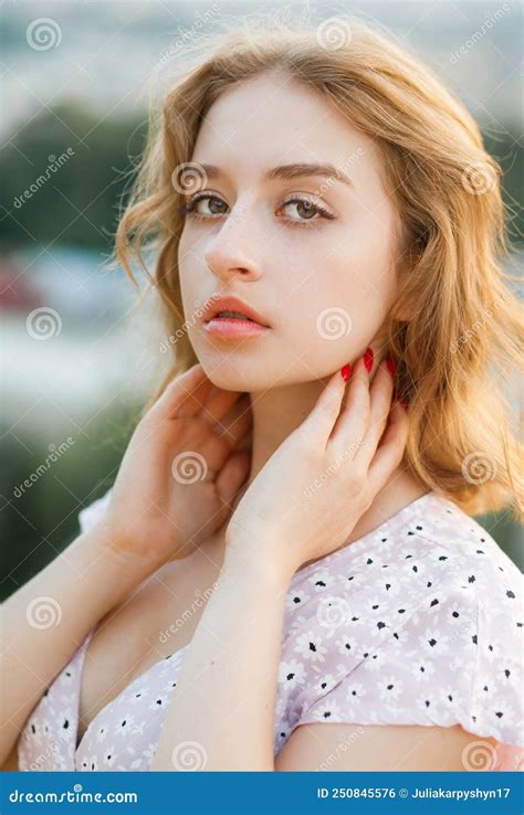 Close Up Portrait Of A Stylish Short Haired Blonde At Sunset Stock