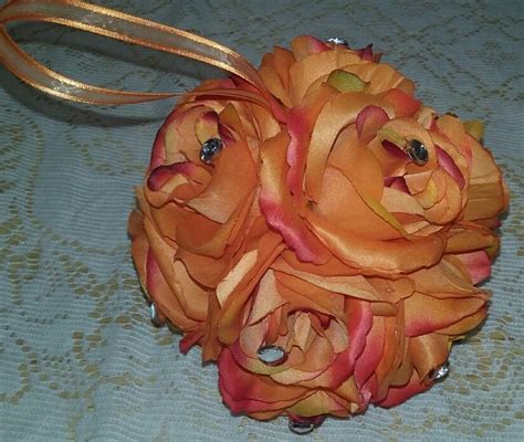 This Flower Girl Pomander Ball Was Made With Orange Open Roses And