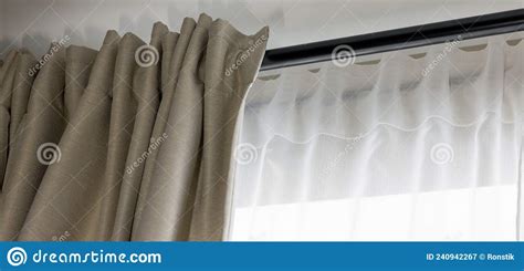 Double Layer Day And Night Curtains On Black Rod In Living Room Stock