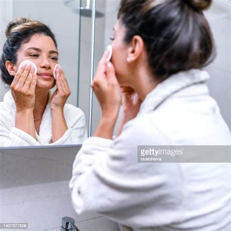 Woman Removing Robe Photos And Premium High Res Pictures Getty Images