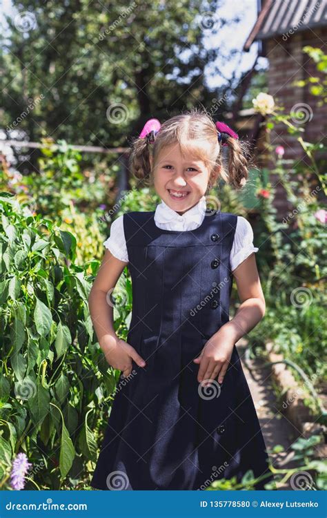 Cute Little Girl In A Garden In The Countryside Stock Photo Image Of