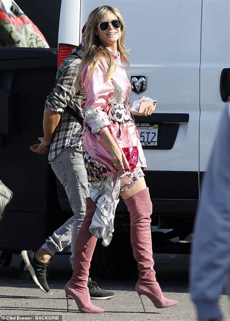 Heidi Klum Flashes A Peace Sign In Head To Toe Pink As She Films