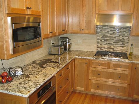 Kitchen remodel from village home stores with subway tiles and outlets/switches installed with calacatta laza quartz countertops. Kitchen Tile Ideas for the Backsplash Area - MidCityEast