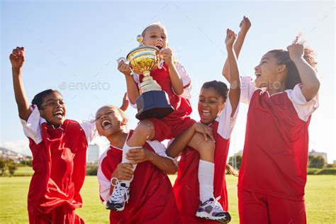 Soccer Team And Trophy With Children In Celebration Together As A Girl