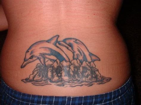 tribal dolphin tattoos design for lower back