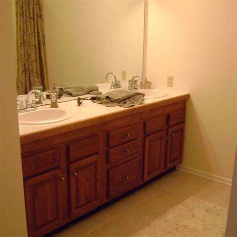 The tiles are a light neutral color. Diy Painting Bathroom Cabinets - Home Furniture Design