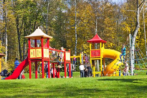 Kids Playing In A Park Playground Editorial Photo Image Of Trees