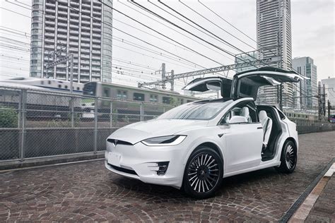Every model x includes tesla's latest active safety features, such as automatic emergency braking, at no extra cost. Futuristic Looks of White Tesla Model X on Black Matte ...
