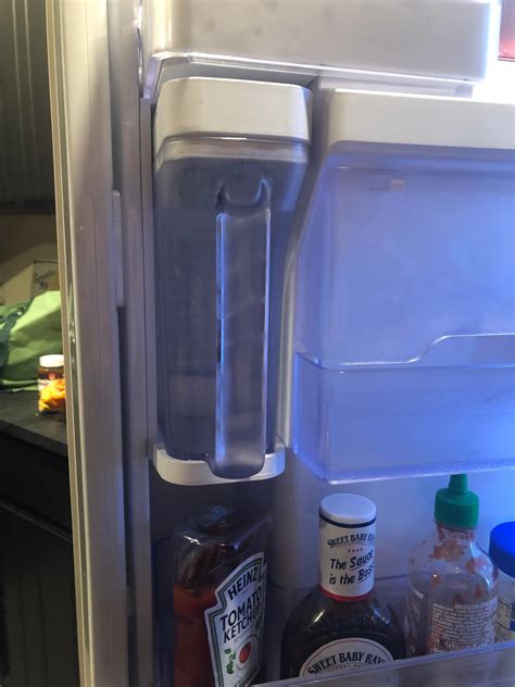 About a year ago, we noticed water leaking from the bottom on the fridge, under crisper drawers, and a sheet of ice(!) under the cooler drawer. This fridge has a mini filtered water pitcher built in ...