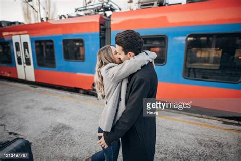 Couple Kissing In Train Station Photos And Premium High Res Pictures