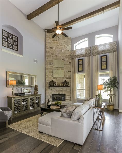 Stacked stone fireplace surround with mantel shelf & tile hearth. Gehan Homes Stanford Fireplace Beige stone fireplace with ...