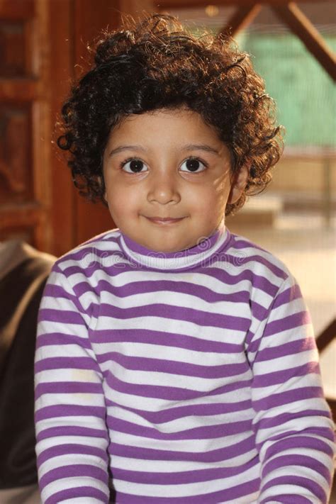 Cute Curly Hair Light Skin South Asian Boy Stock Photo