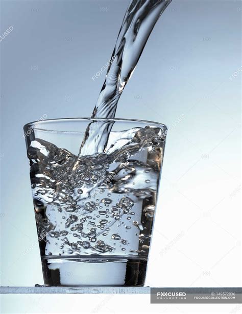 Pouring Water Into Glass — Indoors Rustic Stock Photo 149572836