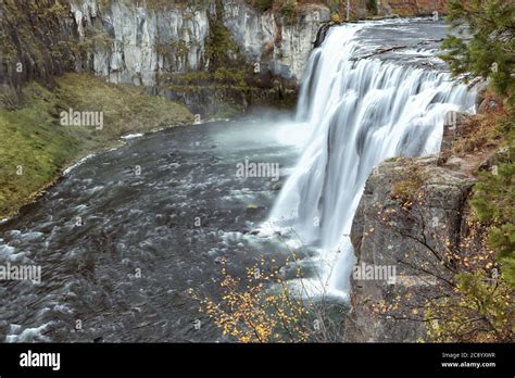 Water Flows Over Upper Mesa Falls In Autumn On The Henry S Fork Of The
