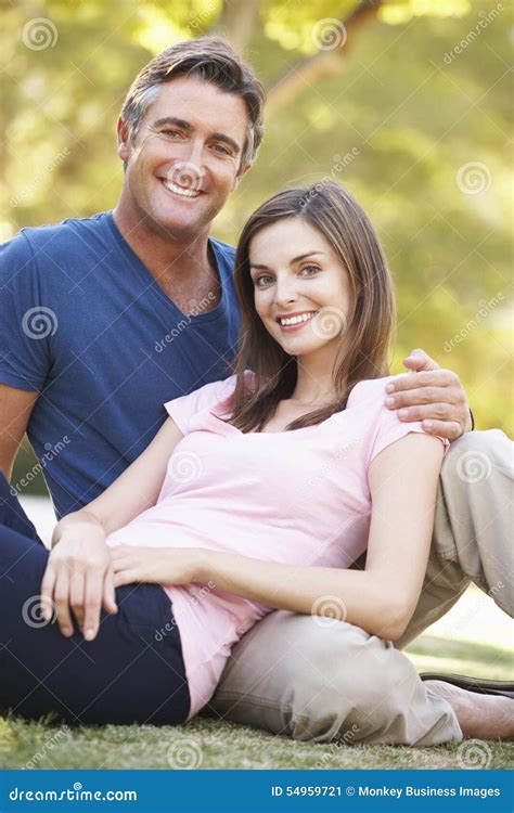 Romantic Couple Sitting On Grass In Summer Park Stock Image Image Of