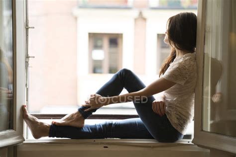 Woman Sitting On Window Sill Opened Caucasian Stock Photo