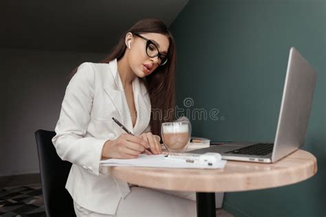 Cute Beautiful Business Woman Sit Indoors In Office Using Laptop